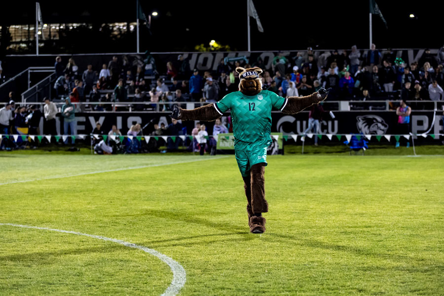 Utah Valley Mascot running on field with arms out